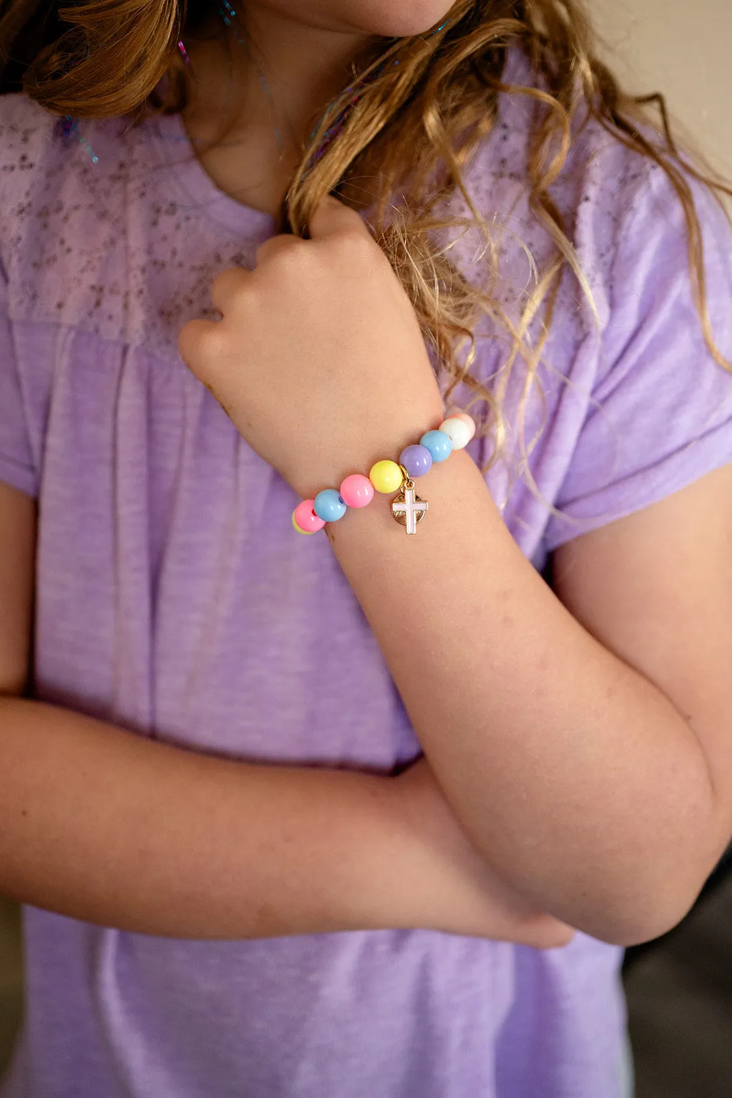 Cross Enamel Pink Charm on Colorful Beaded Stretch Bracelet by Rebecca Accessories