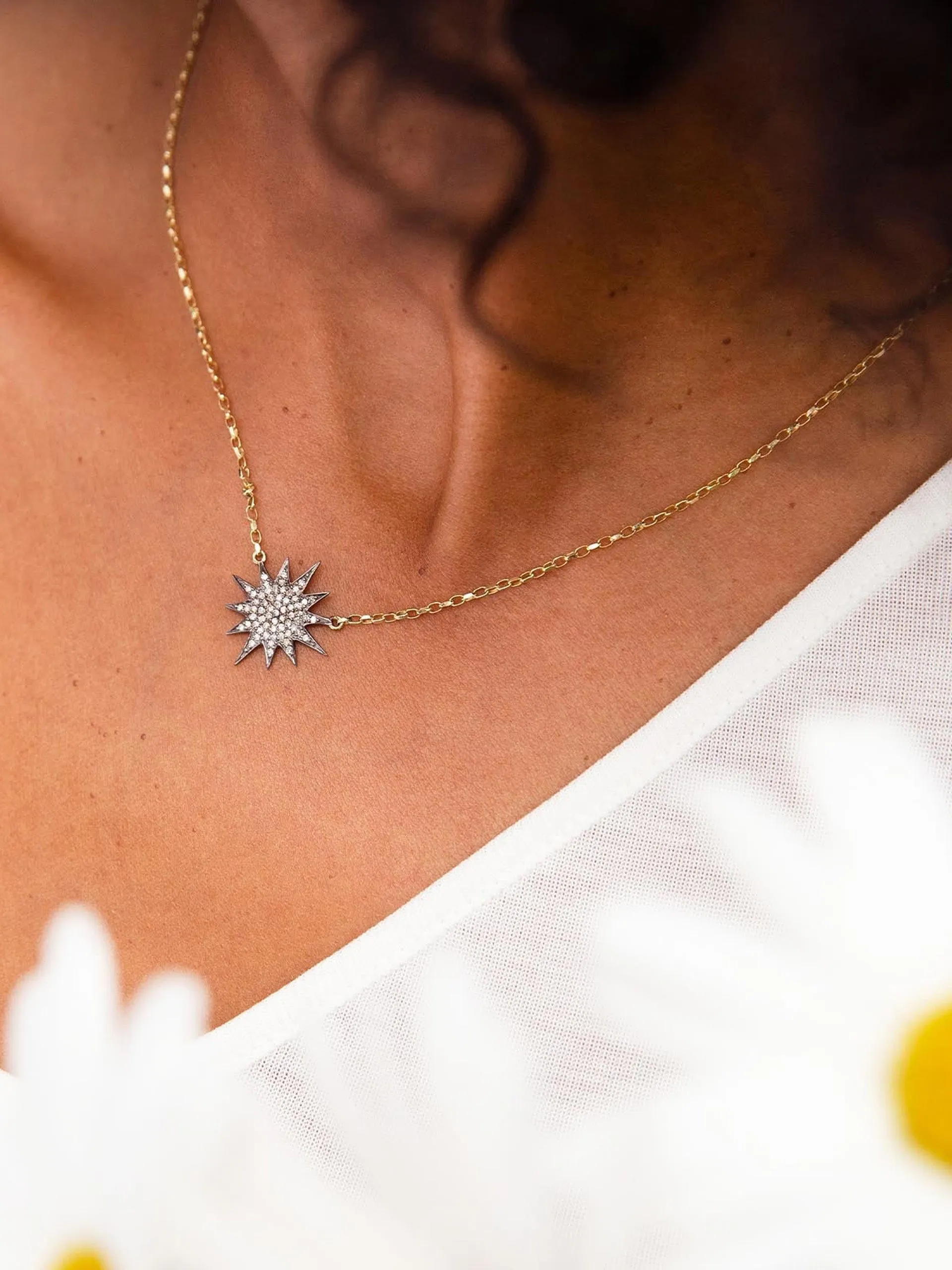 Diamond and gold starburst necklace